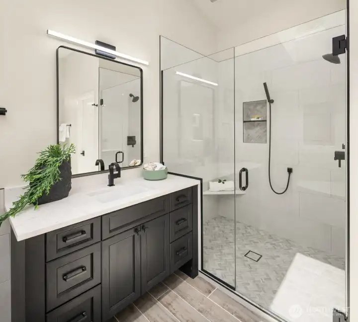 Natural light floods the primary bathroom thanks to multiple skylights.
