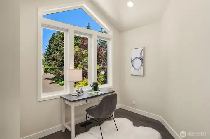 Tall windows are present throughout the home.