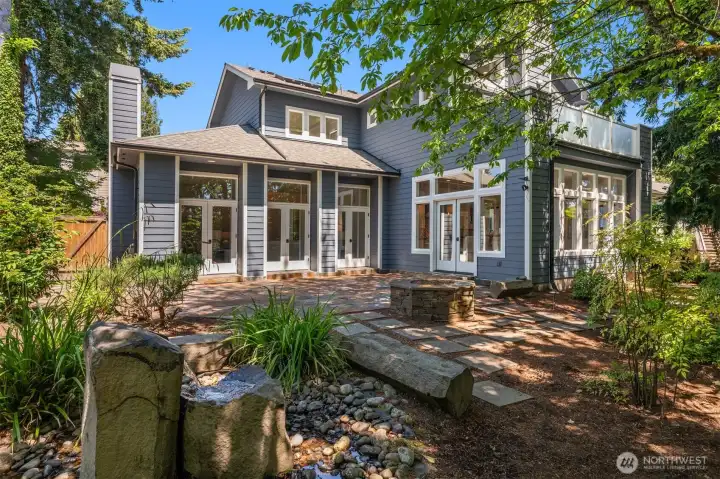 The backyard is south-facing and private, with pretty treed views.