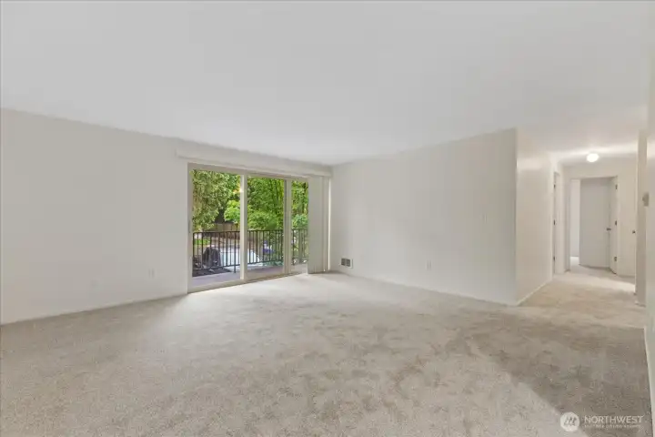Living room with view to hall and bedrooms beyond.