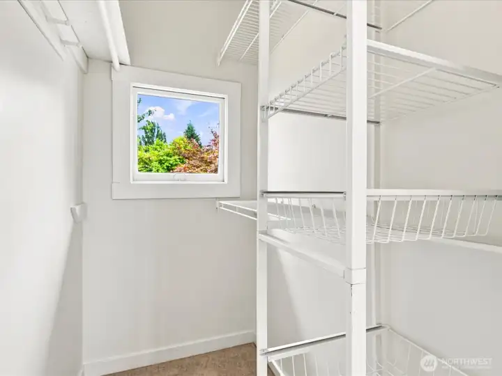 Walk-in closet with shelving Walk-in closet with shelving
