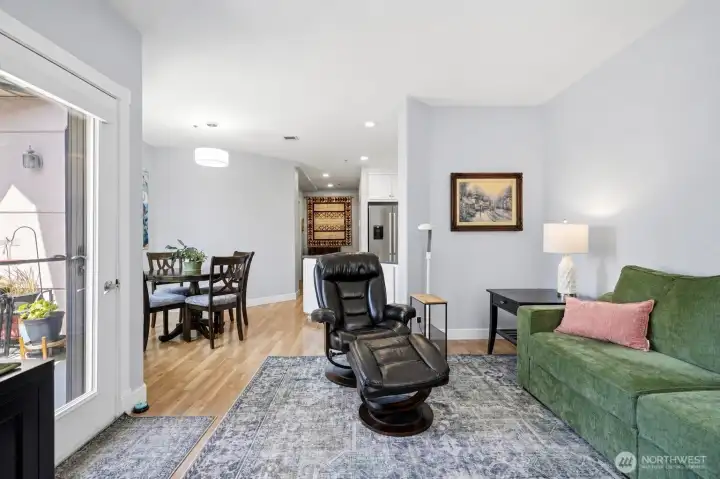 Spacious living room with west-facing natural light. Spacious living room with west-facing natural light.