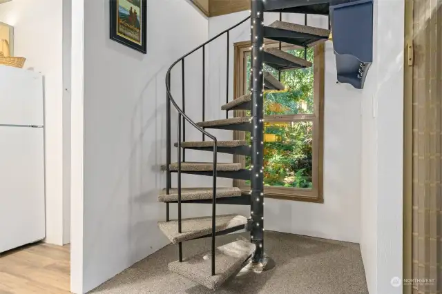 Spiral stairs to loft.