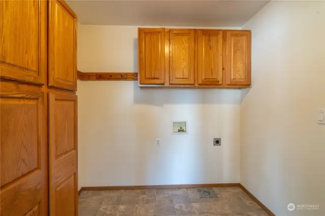 Laundry room with loads of storage