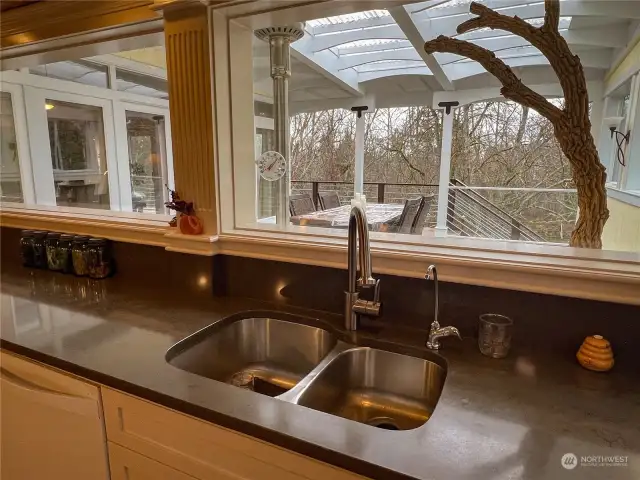 Chef kitchen with new appliances and amazing island design. Custom features abound. Easy to tell that the creator of this kitchen is also a master cabinet maker. So many hidden storage features!