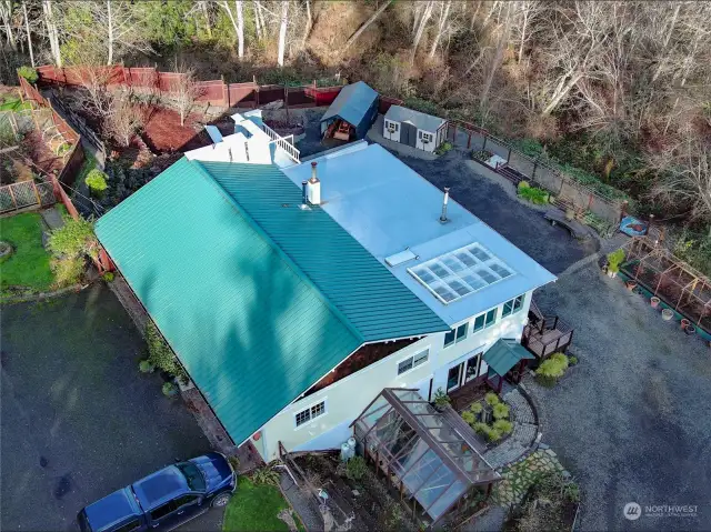 120' of Frontage on Oak Bay Road for visibility and easy of access for your potential customers. Plenty of parking and workspace off-street as well. Gardens, greenhouse, large chicken coop and storage in the back area.