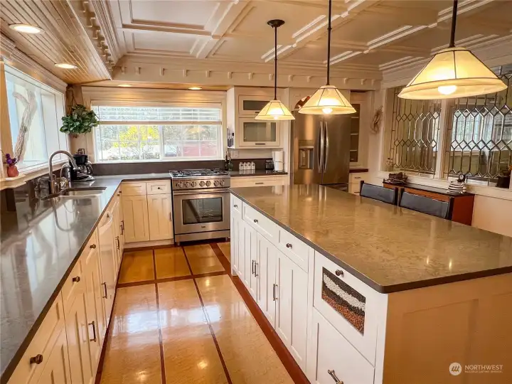 Chef kitchen with new appliances and amazing island design. Custom features abound. Easy to tell that the creator of this kitchen is also a master cabinet maker. So many hidden storage features!