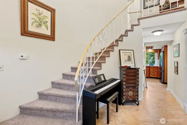 Foyer with dramatic staircase to the upper level
