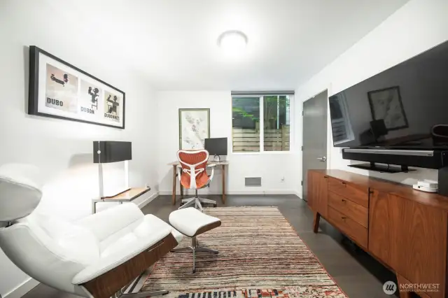 Versatile third bedroom on the lower level for a home office, media setup, or guest room.