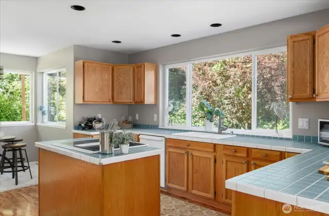 Kitchen with sweet eating spaces at the counter or in the nook - and great island for cooking!
