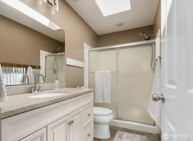Upstairs - updated 3/4 bathroom off of the Primary suite and guest bedroom.