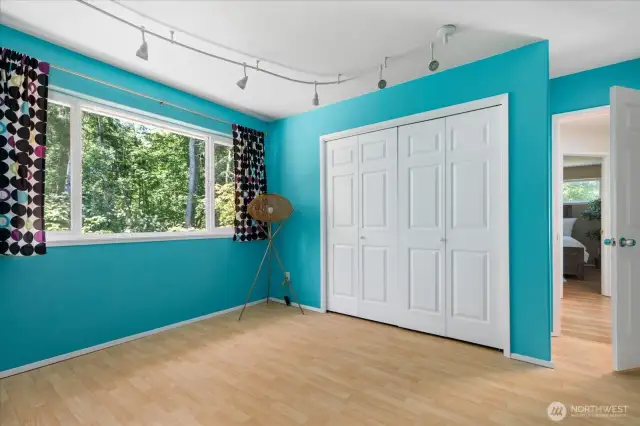 Nice size closets for storage in this room as well as lovely windows looking out to the trees and forest nearby.