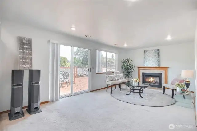 Family room w/ fireplace and slider to huge entertainment size deck