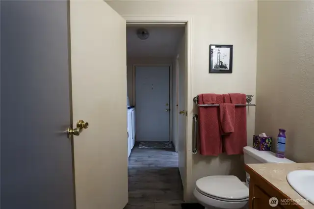 Guest bath leading to the laundry/back door