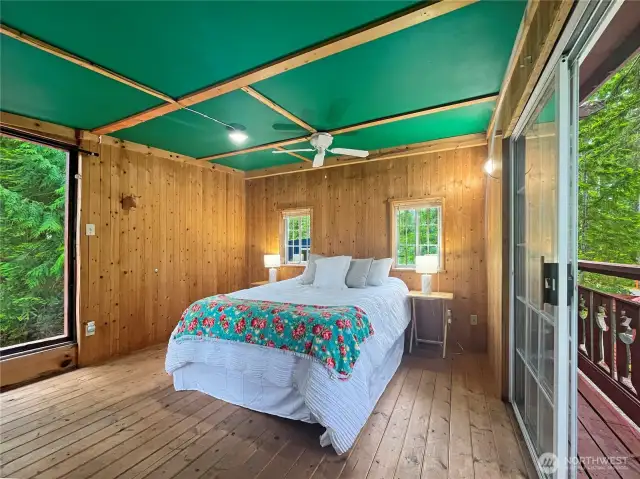 Loft bedroom gives the feel of being in a tree house with double decks and sliders allowing for lots of light and airflow