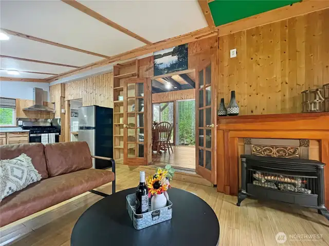 French doors off living space lead to cozy breakfast area