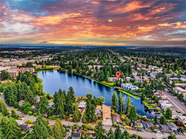 From sunrise to sunset, your top-corner penthouse frames the beauty of Bitter Lake with panoramic views, private dock privileges, and an unbeatable location