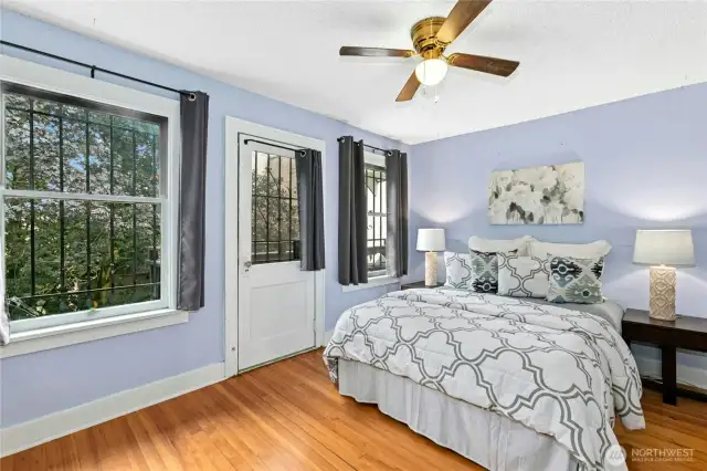 The first of the three upper-level bedrooms has a walk-in closet and a private balcony. The seller's used this as the primary bedroom.