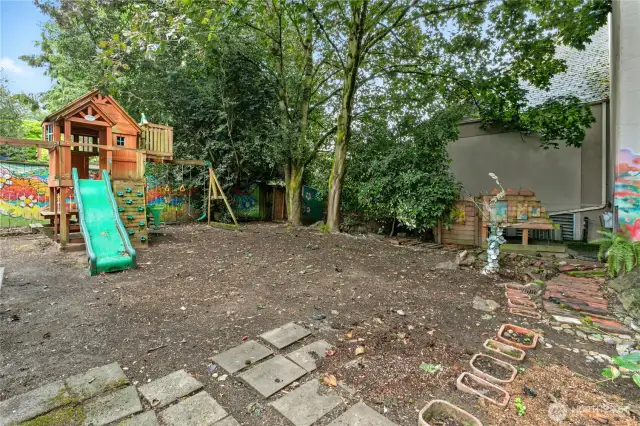 Another view of the backyard and the sculpture to the right is by local artist Michael O'Driscoll and is included in the sale.