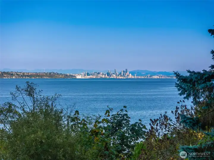 The home faces east, welcoming glorious sunrises over the Seattle skyline.