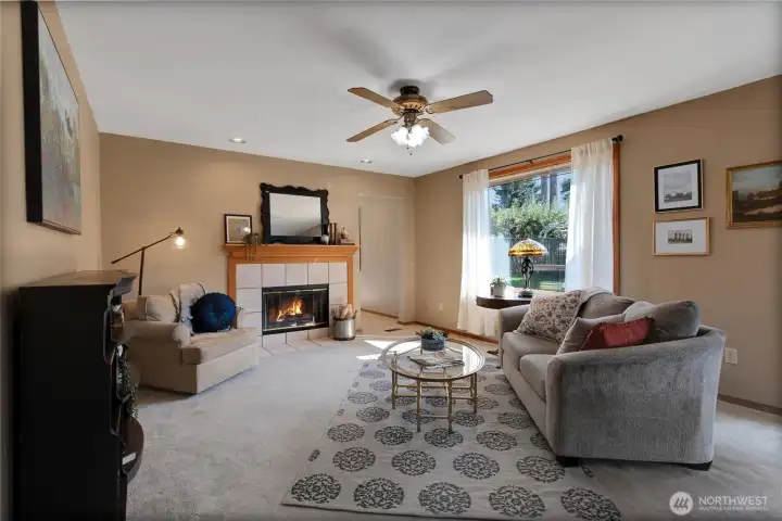 This is the living space off of the kitchen with gas fireplace. The door at the back of the room on the right leads to the Bonus Room.