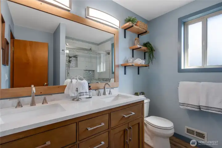Tiled shower in Upstairs Hall Bath.