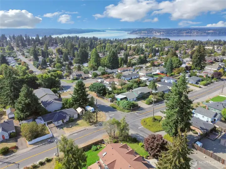 Overhead view of the corner lot, 4 way stop, and just a few minutes to our Beautiful Puget Sound!