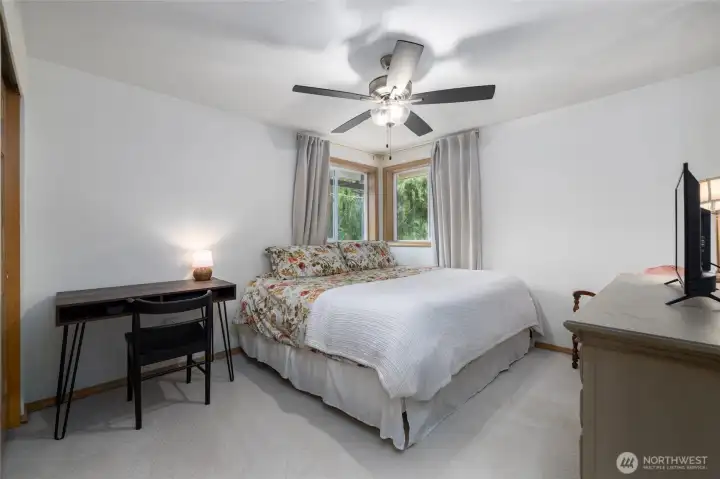 One of 3 spacious guest bedrooms.  New carpet and pad, generous closet.  All bedrooms have ceiling fans and California Closets closet systems.