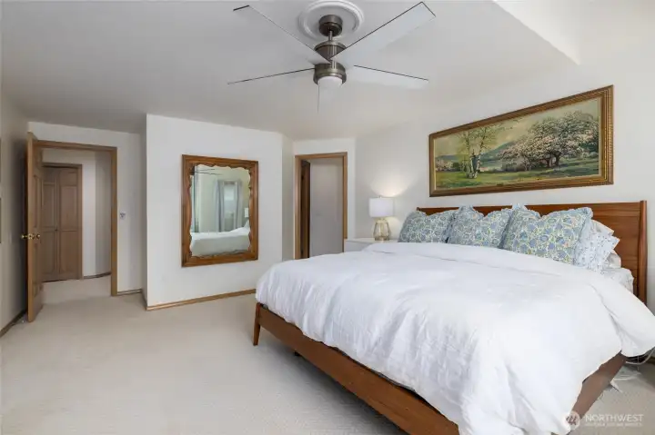 Primary suite. Ceiling fans in the bedrooms.