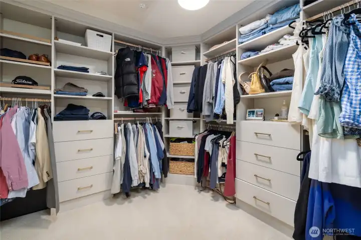 California Closets system has built-in drawers, shoe storage.  Closet continues out of frame to the right.