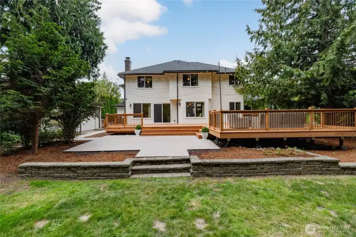 Situated on a level 1/3 acre lot, the fenced backyard features a new wood deck spanning over 600/sf, paver patio, a garden shed, and plenty of room for play, pets, and entertaining.
