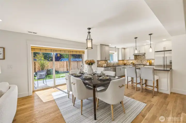 Spacious dining area to gather and eat, as well as access to the back yard.