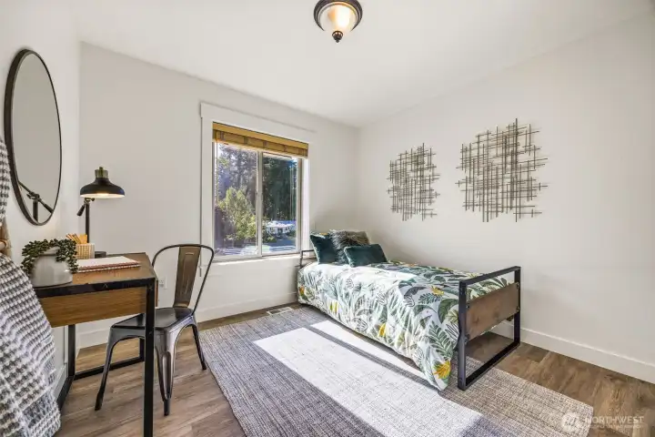 The first of 2 upper floor guest rooms with walk-in closet.