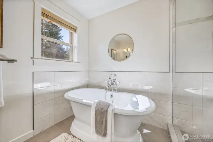 Full primary bathroom with perfect soaking tub.