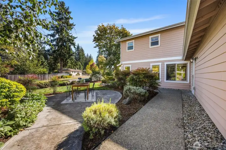 The front yard has space to relax or dine.