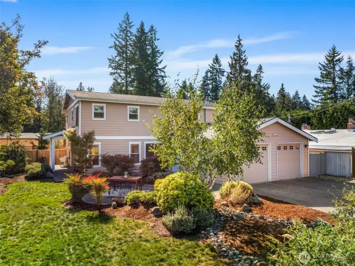 Front yard is perfect to garden, play, or relax.