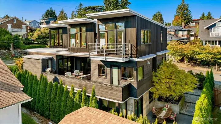 Expansive windows and multiple terraces blur the lines between indoors and out, perfectly capturing city living with style.