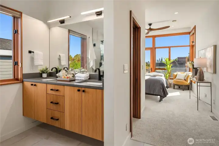 A spa-inspired en suite bath with dual vanities blends function with contemporary style.