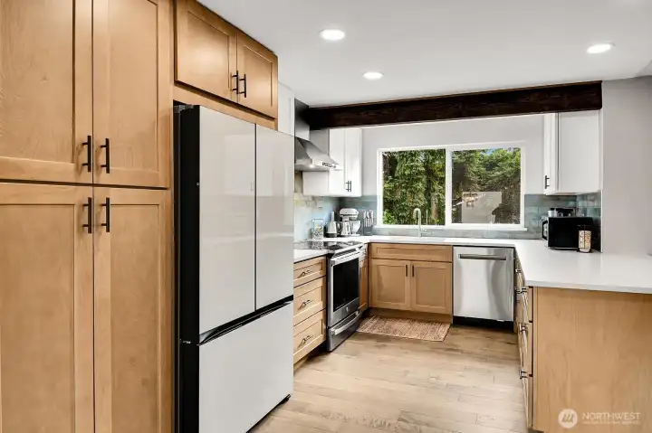 Amazing updated kitchen with all new soft close cabinetry, quartz counters, and new appliances!