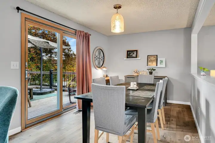 The dining room offers ample space and opens directly to the spacious deck—perfect for entertaining or outdoor dining.