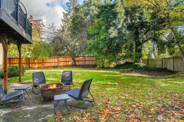 Out back, the fully fenced yard provides space to relax, garden, or give pets room to play.