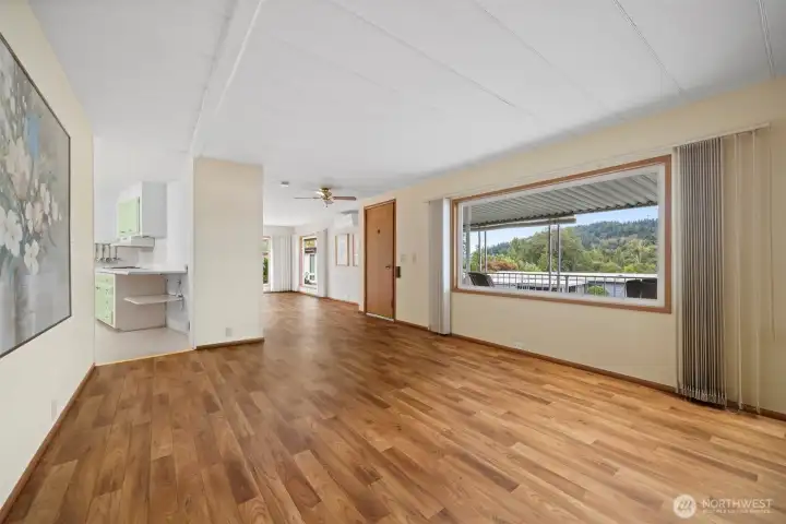 Living room with large picture window over looking the covered front porch.
