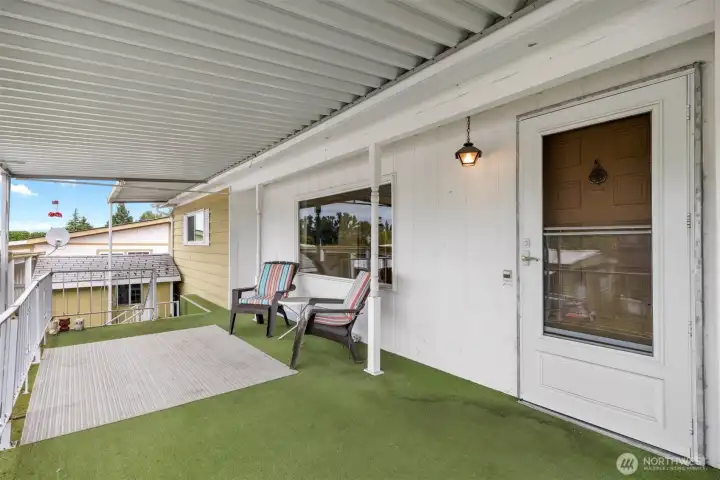 Huge covered front deck.