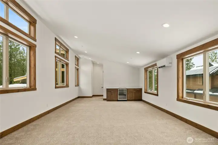 550 sq foot bonus room over 3 car garage with separate staircase and private bath.