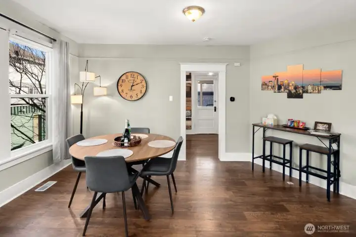 Unit #2015: Another view of the dining room, showing the passage to the kitchen and door to the covered back porch beyond.