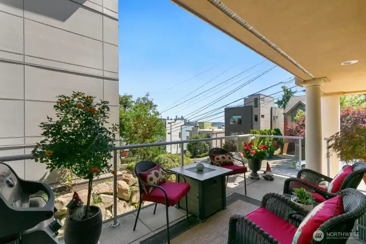 Large covered southeast facing deck with city views.