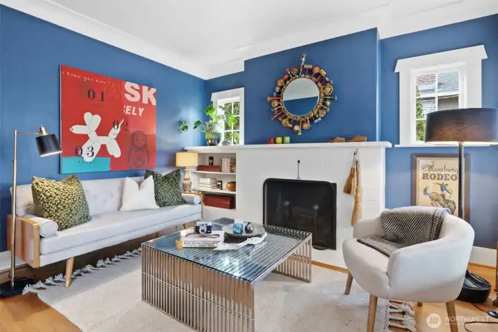 A wood-burning fireplace creates a warm, story-filled interior. Thoughtful updates blend modern functionality with preserved character.