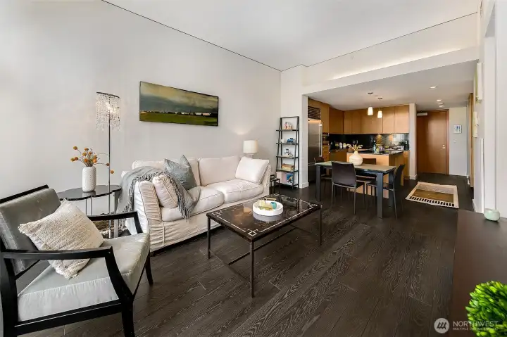 Spacious open living layout with dining and display kitchen.