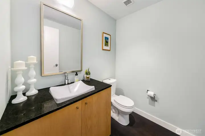 Convenient half bath for guests.