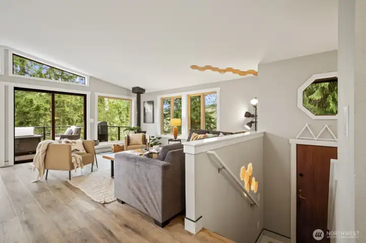 Open-concept main floor great room with vaulted ceilings and skylights.